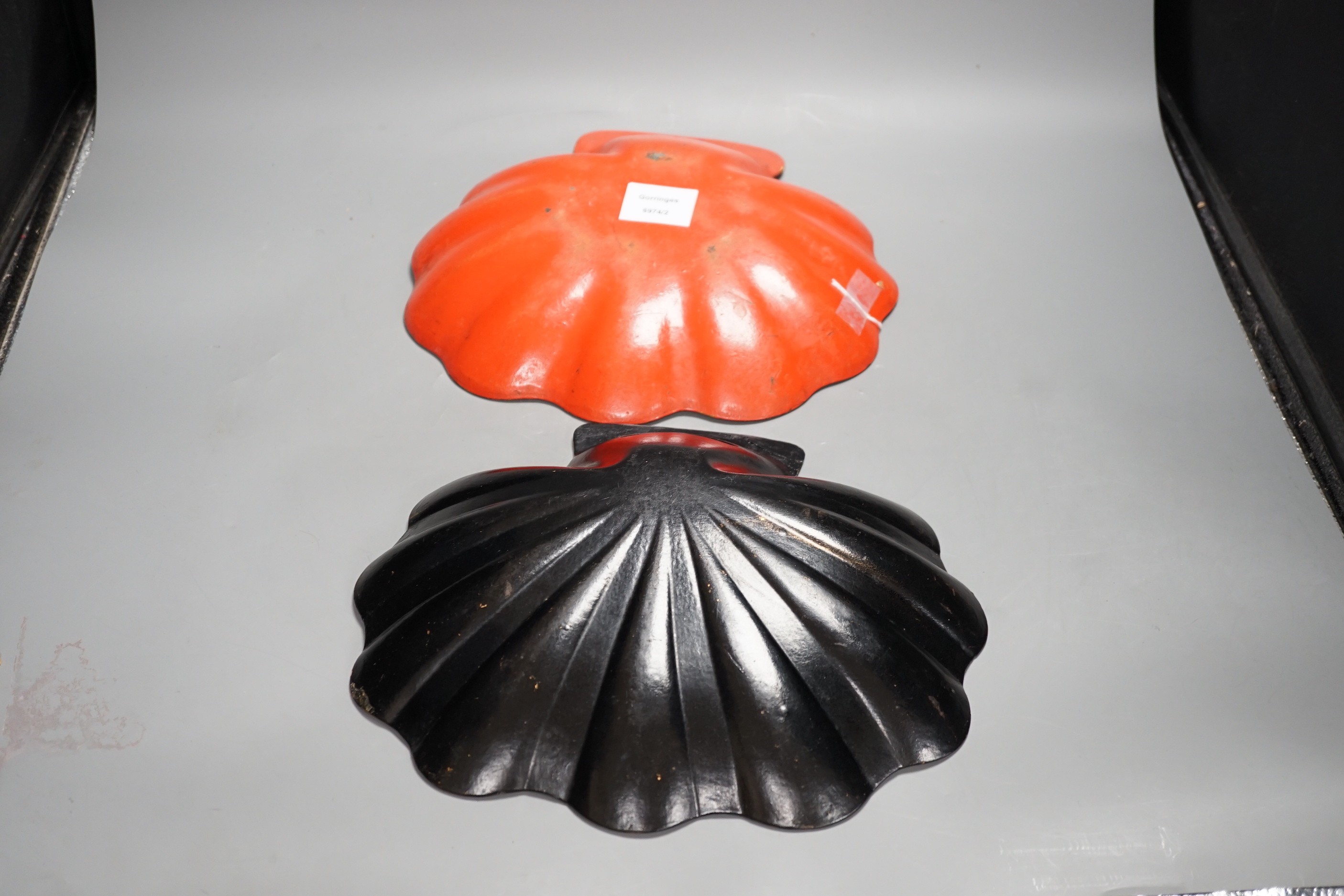 Two early 20th century japanned scallop shell dishes, 29cm wide